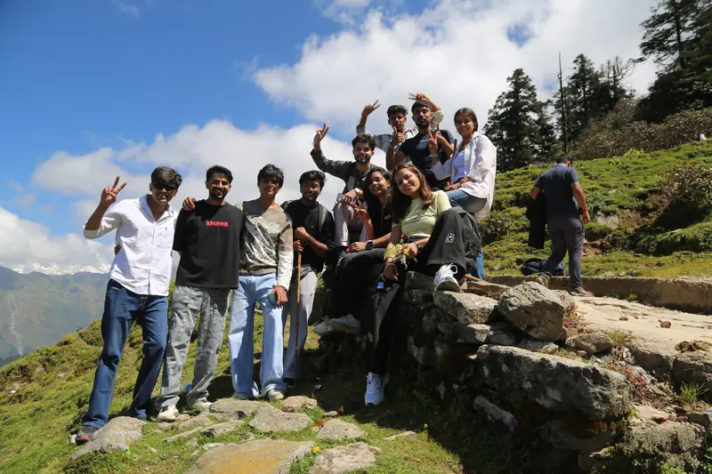 Friends sharing a pause on a mountain journey